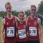 Three cross country athletes arm in arm. Image links to Athletics and Cross Country page on Bristol SU website.